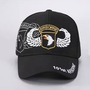 Detailed embroidery of 101st Airborne eagle shield on a black cotton baseball cap