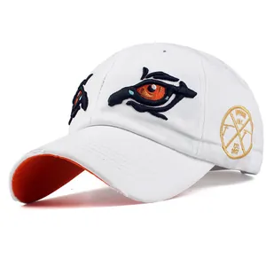 White cotton baseball cap with embroidered eyes and orange undervisor detail
