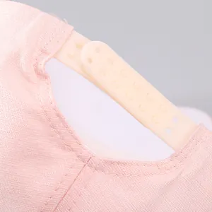 Close-up of pink baseball cap featuring adjustable snapback strap and fine stitching