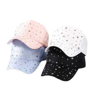 Sparkly baseball caps with silver studs and star accents in pink, blue, white, and black