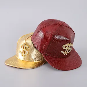 Close-up of snake skin textured snapback hats with rhinestone dollar sign badges