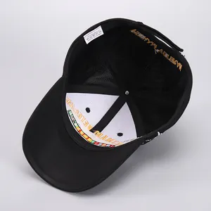 Detailed view of internal laundry tag and acrylic fabric stitching on baseball cap