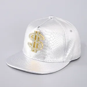 Close-up of silver snake skin pattern snapback hat with rhinestone gold dollar sign