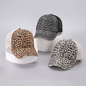 Three distressed leopard print mesh baseball caps in brown, grey, and off-white colors
