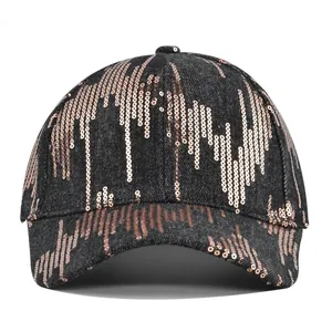 Detail of rose gold sequins on black denim baseball cap with wavy pattern
