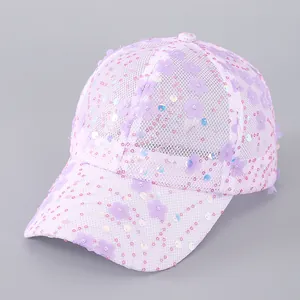 Detailed view of purple mesh baseball cap featuring 3D flowers and colorful sequins