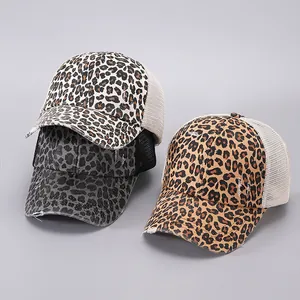 Detailed view of distressed leopard print trucker hats with mesh back and ponytail hole