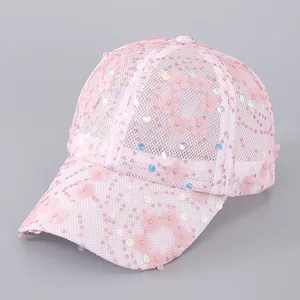 Detail of pink mesh baseball cap with sequin embroidery and 3D floral appliqués