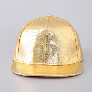 Detail of gold PU leather snapback hat with snakeskin texture and rhinestone dollar sign
