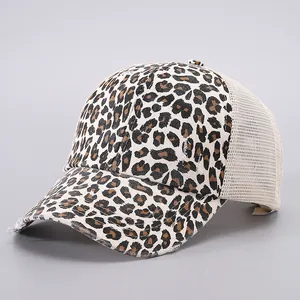 Detail view of distressed leopard print canvas and breathable mesh on baseball cap