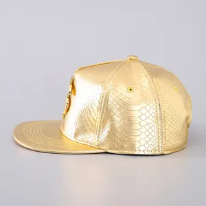 Detailed side view of the metallic gold snapback hat with snake skin texture