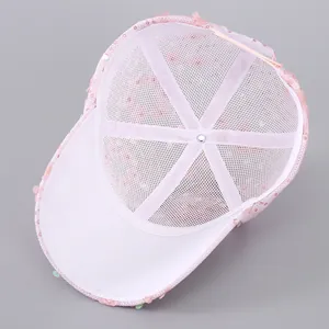 Detail of pink sequin baseball cap showing breathable white mesh lining and inner seams