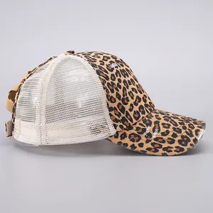 Detail view of leopard print baseball cap with distressed brim and breathable mesh back
