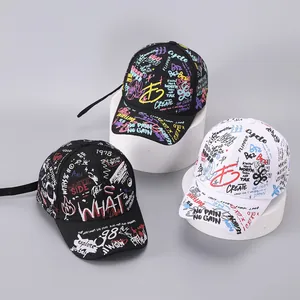Detail of street style graffiti baseball caps with slogans and extra long adjustable straps