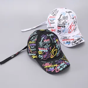 Detailed view of colorful graffiti prints and extra-long ribbons on hip-hop baseball caps