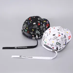 Graffiti baseball caps in black and white with long straps and colorful street art patterns