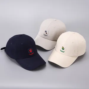 Detailed view of cotton baseball caps with embroidered bucket fork and corn patches