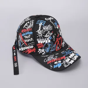 Detail of black graffiti baseball cap with printed ribbons and street style calligraphy
