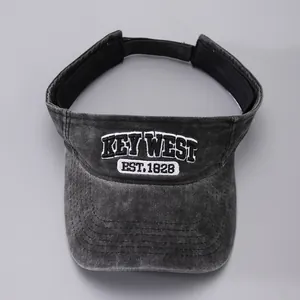 Detailed embroidery of white KEY WEST text on dark gray washed cotton sun visor cap
