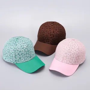 Detailed embroidery on floral baseball caps in teal, brown and pink fabric options