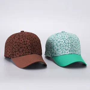 Detailed close-up of vintage floral baseball caps in brown and green cotton fabric