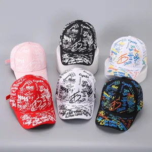 Multiple graffiti baseball caps in black, white and red with colorful urban print designs
