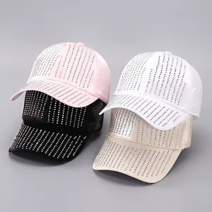 Detail showing shiny satin baseball caps with vertical rhinestone fringe in four colors
