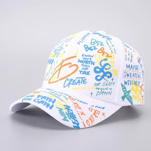 Close-up of a white canvas baseball cap featuring vibrant street graffiti and text