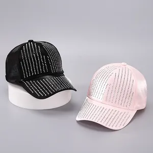 Close-up of baseball caps with glossy satin finish and vertical rhinestone embellishments