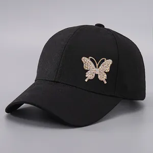 Women's black baseball cap featuring a jacquard texture and colorful rhinestone butterfly