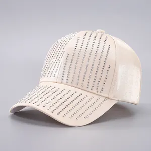 Fashionable champagne gold satin baseball cap with sparkling rhinestone tassel stripes
