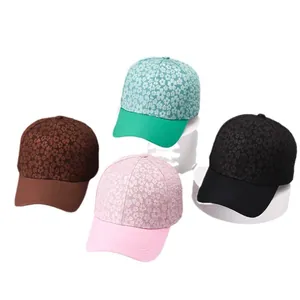 Floral print baseball caps in green pink brown and black with solid curved brims