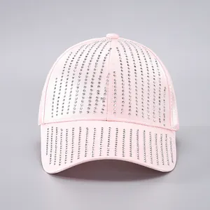 Close-up of pink satin baseball cap with glittering silver rhinestone fringe details