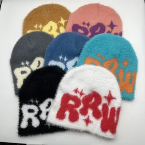 Close-up of soft faux mink knitted beanies with RRW jacquard and star patterns
