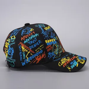 Close-up of black graffiti baseball cap featuring vibrant printed letters and patterns