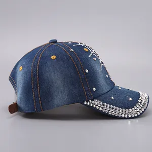 Deep blue denim baseball cap featuring sparkly rhinestones and metallic stud details