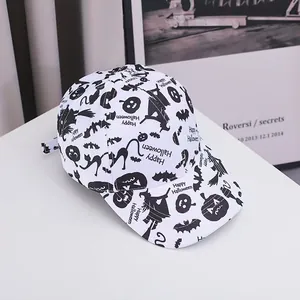 Detail of white baseball cap with black Halloween pumpkin and bat prints on clean background