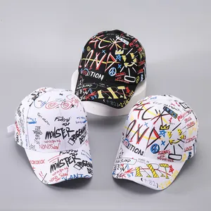 Close-up of graffiti baseball caps featuring monster letters and street style ribbons