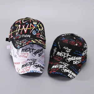 Detail of street style baseball caps featuring graffiti prints and urban lettering