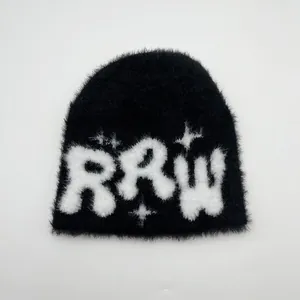 Close-up of black mohair knit beanie featuring white RRW letters and star pattern