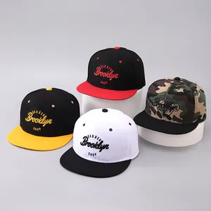 Detail of snapback caps with BARBER Brooklyn SHOP 3D embroidery and twill texture