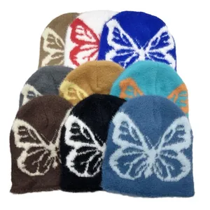 Berretti invernali in maglia felpata con motivi jacquard a farfalla colorati