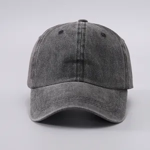 Detailed view of dark grey washed cotton baseball cap texture and stitching detail