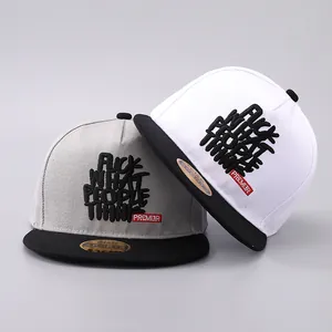 Detail of 3D embroidery on two-tone snapback caps with flat brim and premium texture
