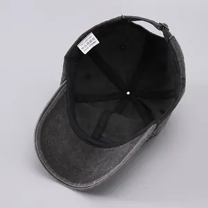 Detail of 100% cotton inner lining and adjustable metal buckle on washed baseball cap