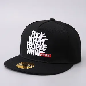 Black snapback hat with white 'FUCK WHAT PEOPLE THINK' embroidery in street style