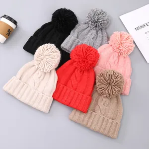Winter chunky knit pom-pom beanies in multiple colors with stylish cable knit texture