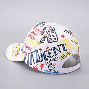 Detailed close-up of graffiti print on white baseball cap featuring vibrant street art style