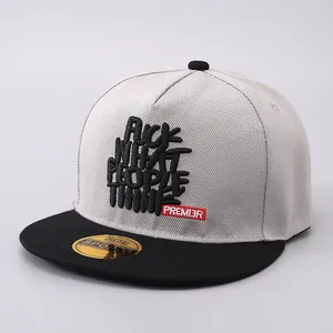 Detail view of slogan embroidery on a flat brim hip hop baseball cap with grey crown