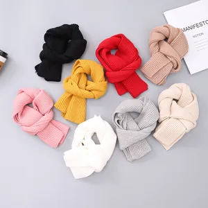 Cozy knit winter beanies for kids with pom poms in eight various solid colors